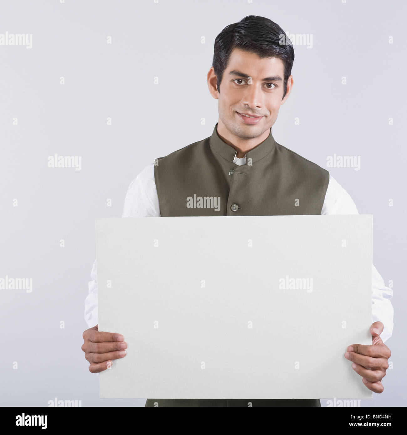 Portrait of an actor portraying a politician and holding a blank placard Stock Photo