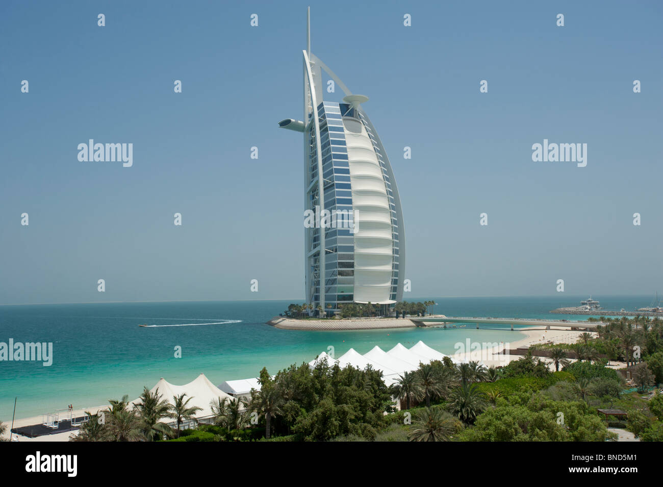 The Burj Al Arab hotel with a speed boat from the beach at Dubai United Arab Emirates Stock Photo