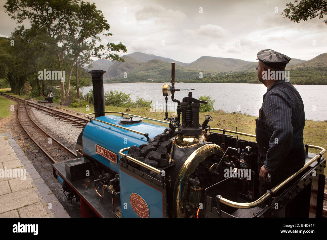 UK, Wales, Snowdonia, Llanberis, Lake Railway, steam train at Cei Llydan station, beside Llyn Padarn Stock Photo