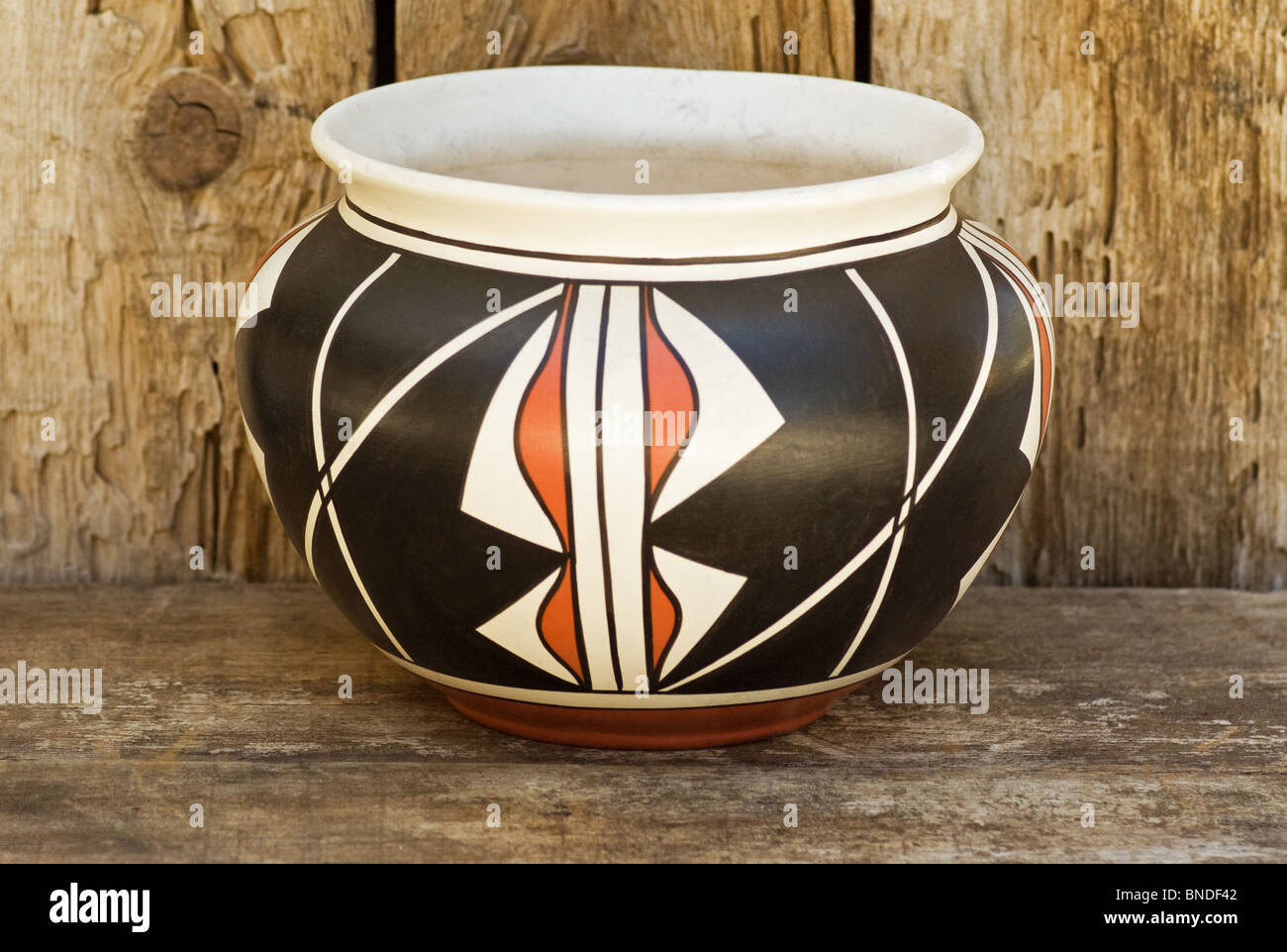 Contemporary Native American Indian clay pot pottery on old wood shelf