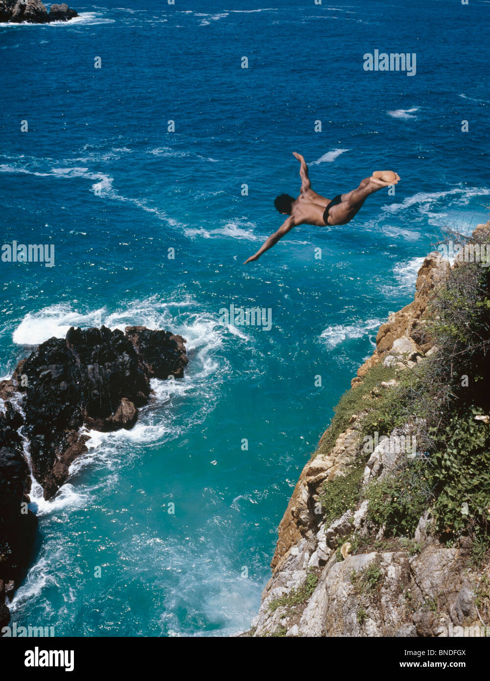 Man diving into the sea, La Quebrada, Acapulco, Guerrero, Mexico Stock Photo