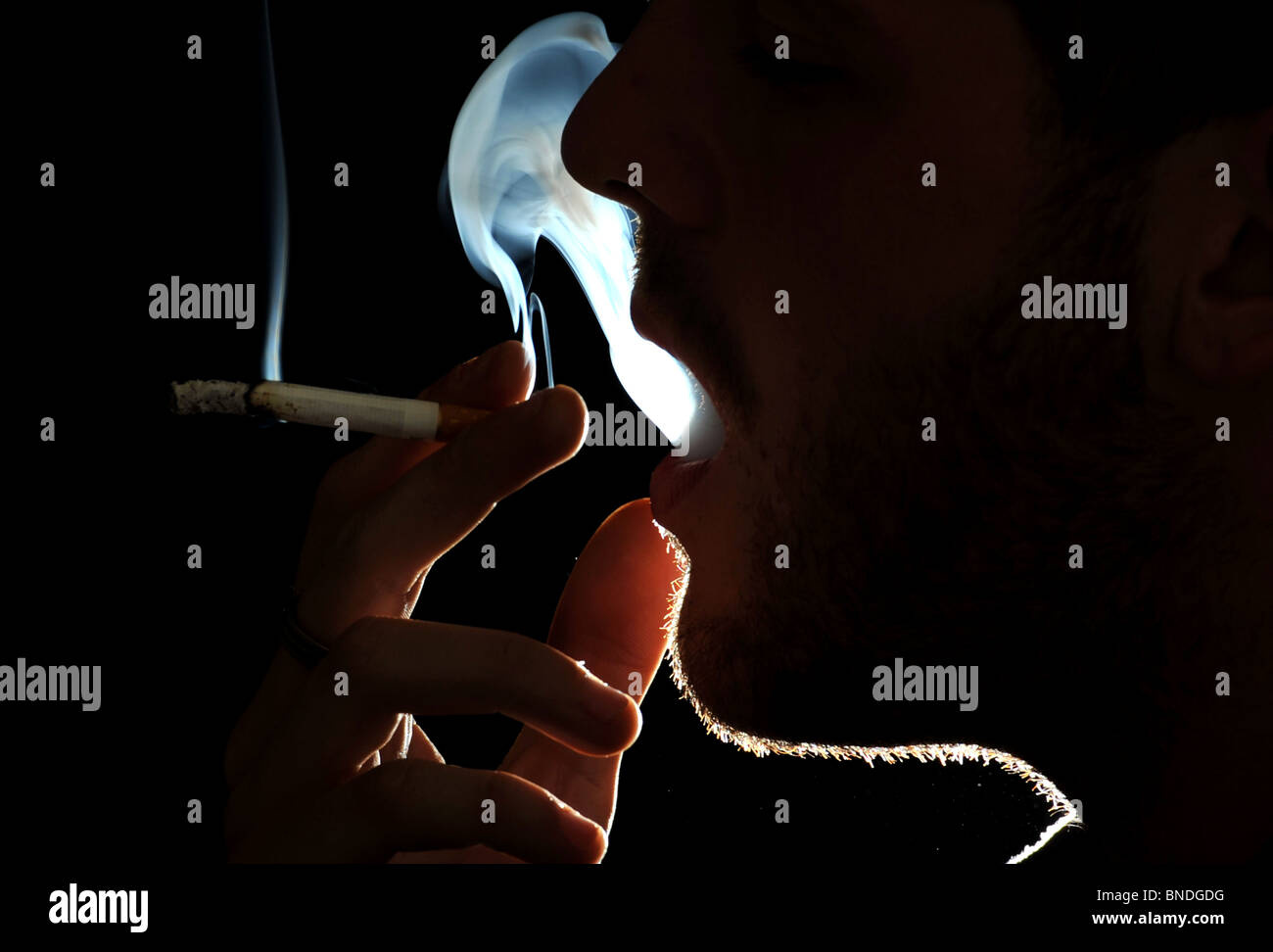 A man smoking a cigarette Stock Photo