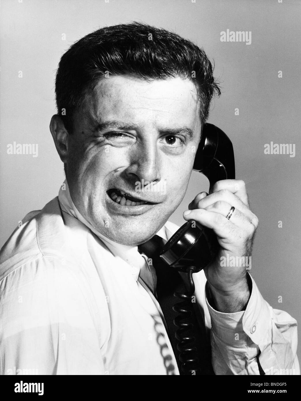 Close-up of a businessman using a telephone Stock Photo