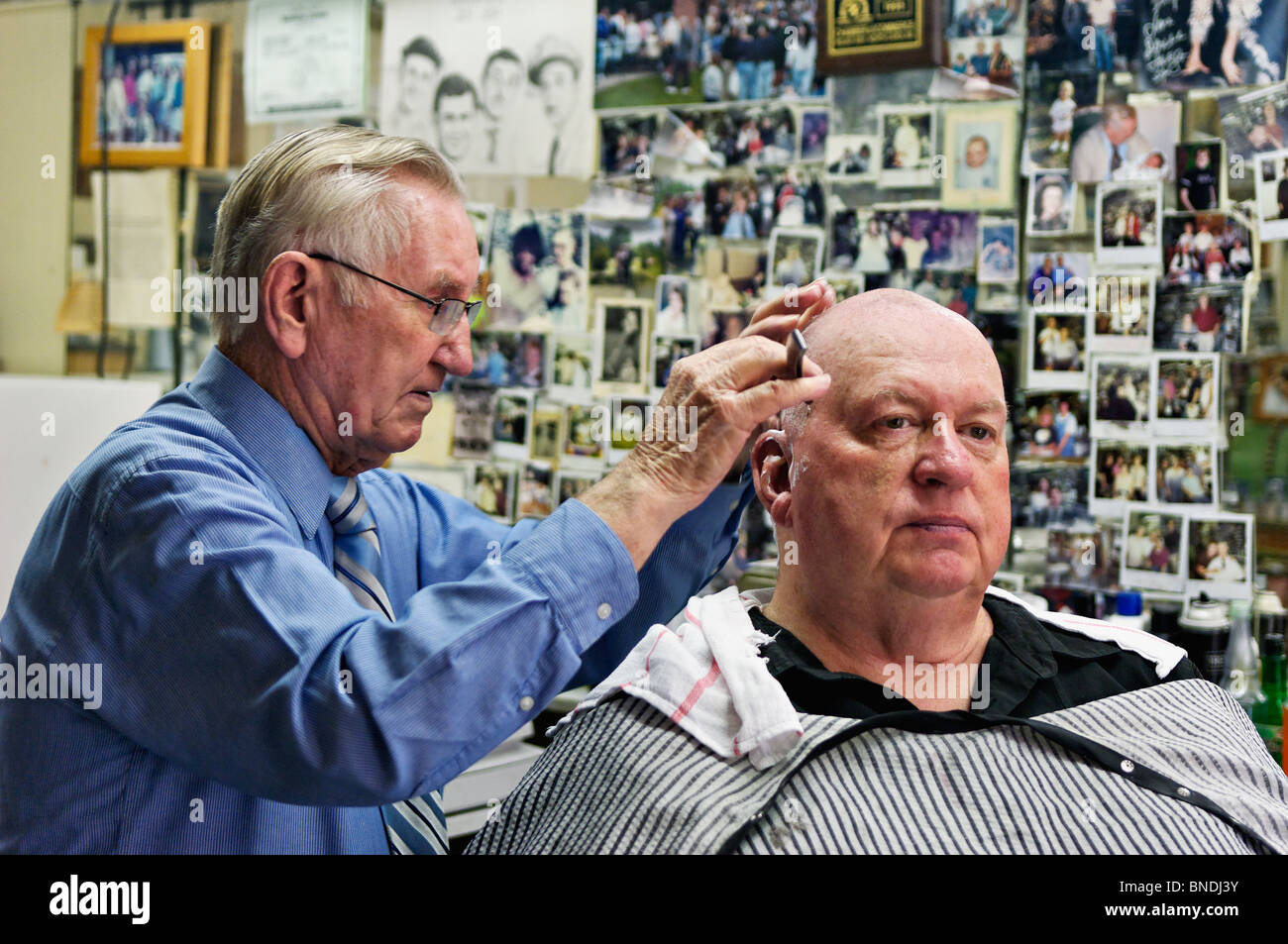 Russell Hiatt Cutting Hair in Floyd's City Barber Shop in Mount Airy, North Carolina Stock Photo