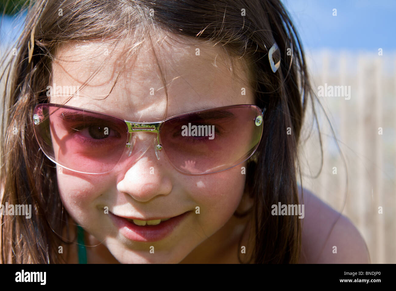 Girl with sunglasses up to camera Stock Photo Alamy