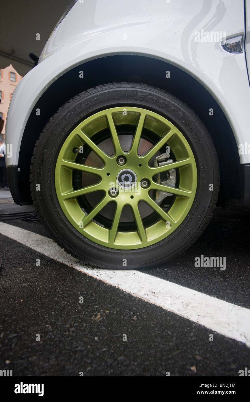 The 'green' wheel of a Smart USA SmartCar Stock Photo