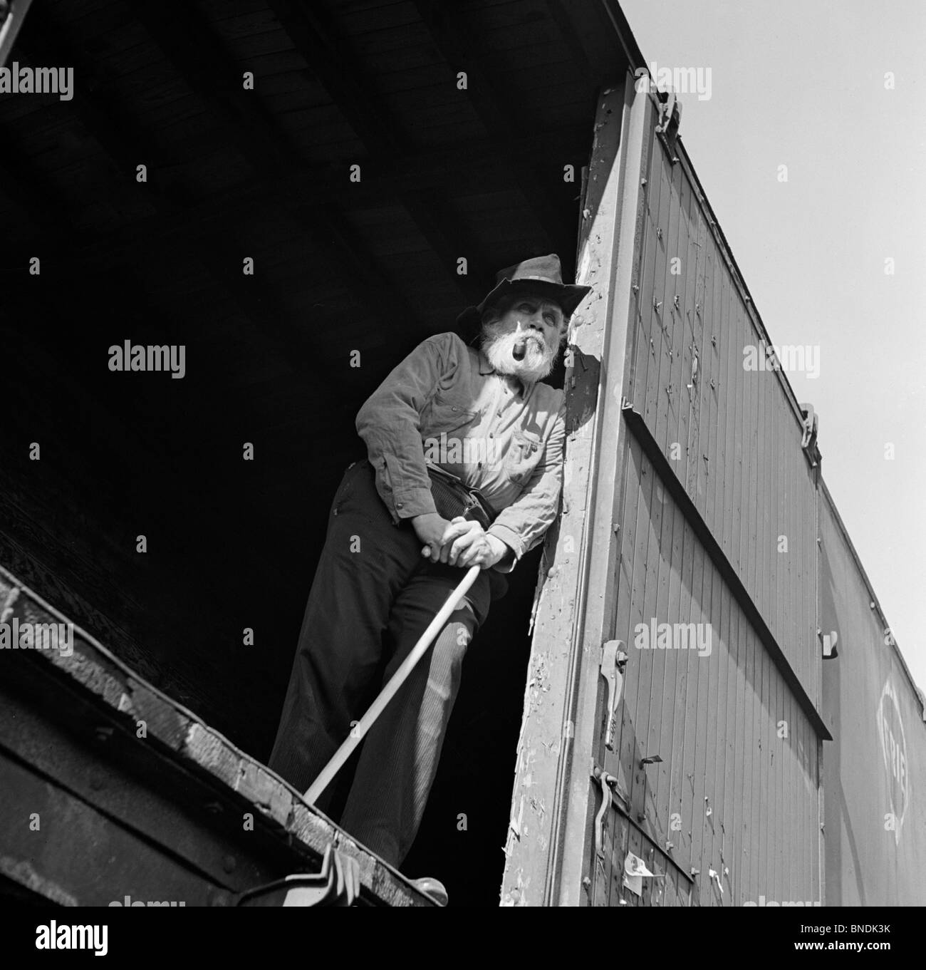 Low angle view of a senior man standing in a train car Stock Photo
