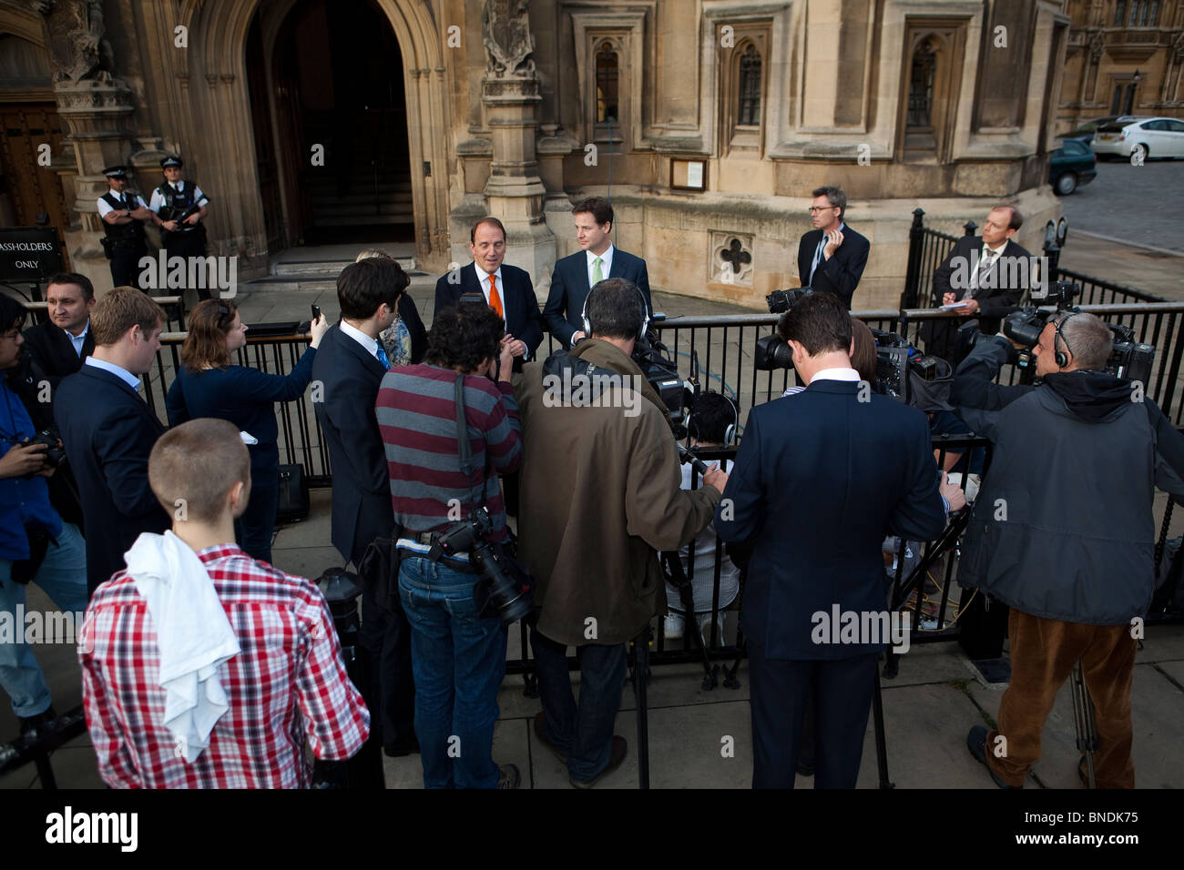 Nick Clegg and Simon Hughes speak to the press outside Parliament following Mr Hughes' election to Lib Dem Deputy Leader Stock Photo