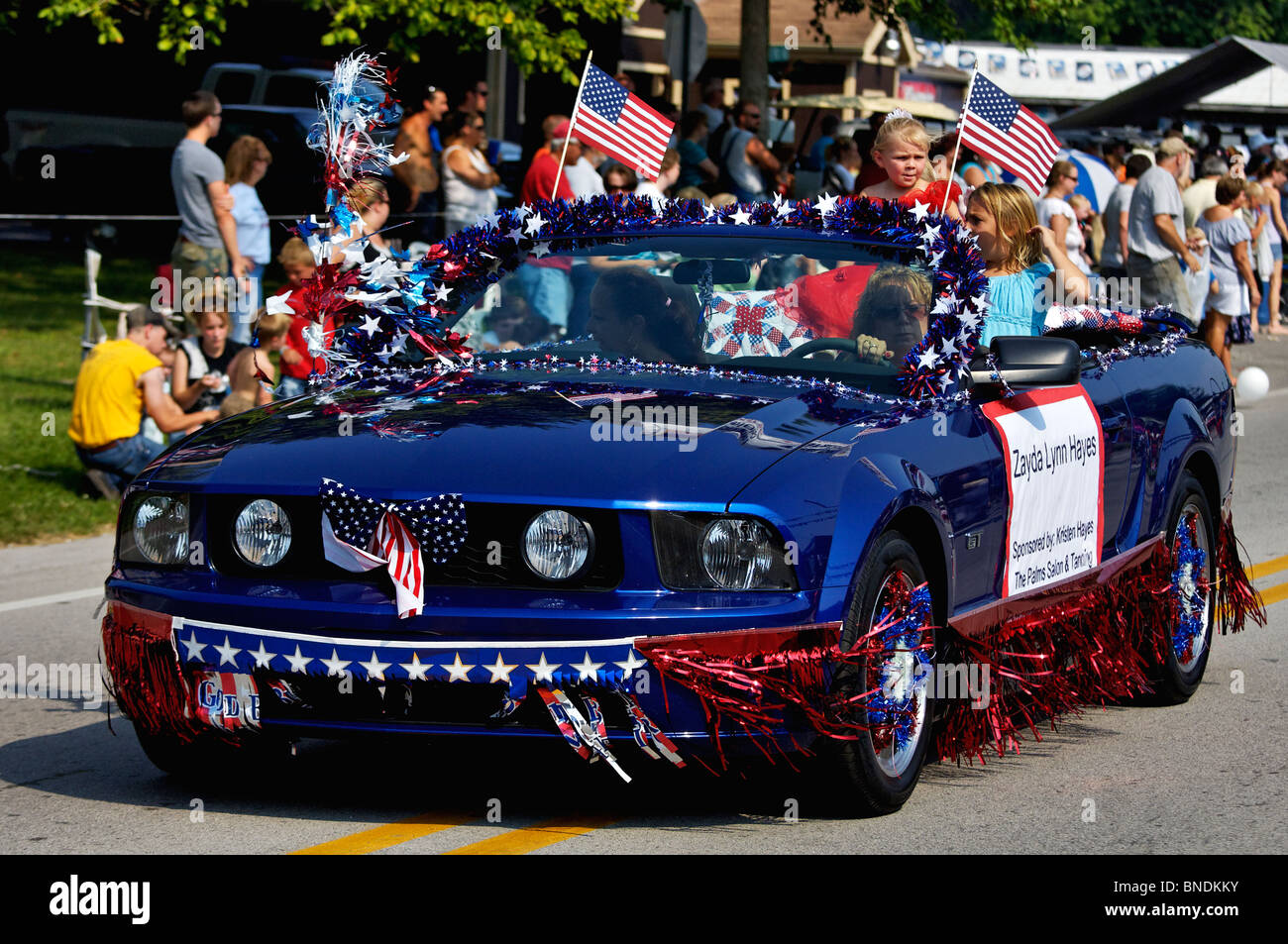 Princess Contestant Rides in Convertible Mustang in Oldest Continuous Independence Day Parade in America in New Pekin, Indiana Stock Photo