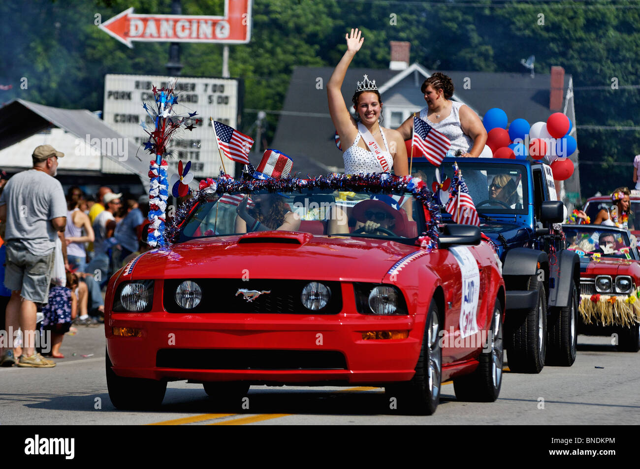 Beauty Queen Contestant Rides in Convertible Mustang in Oldest Continuous Independence Day Parade in New Pekin, Indiana Stock Photo