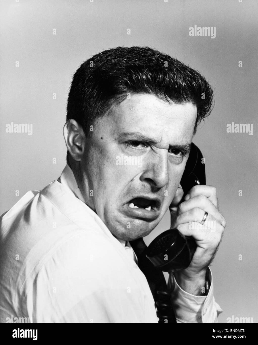Close-up of a businessman shouting on the telephone Stock Photo