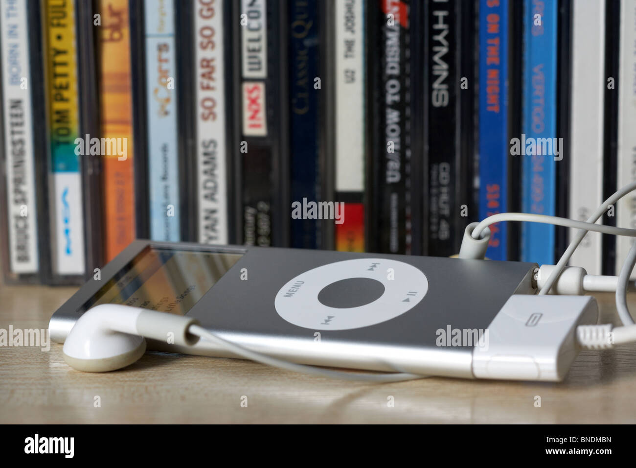 ipod nano in front of a row of old cd album cases in the uk Stock Photo