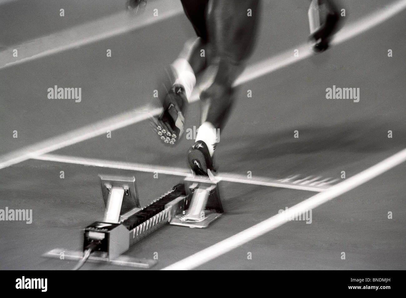 Detail of woman pushing out of the starting blocks Stock Photo Alamy
