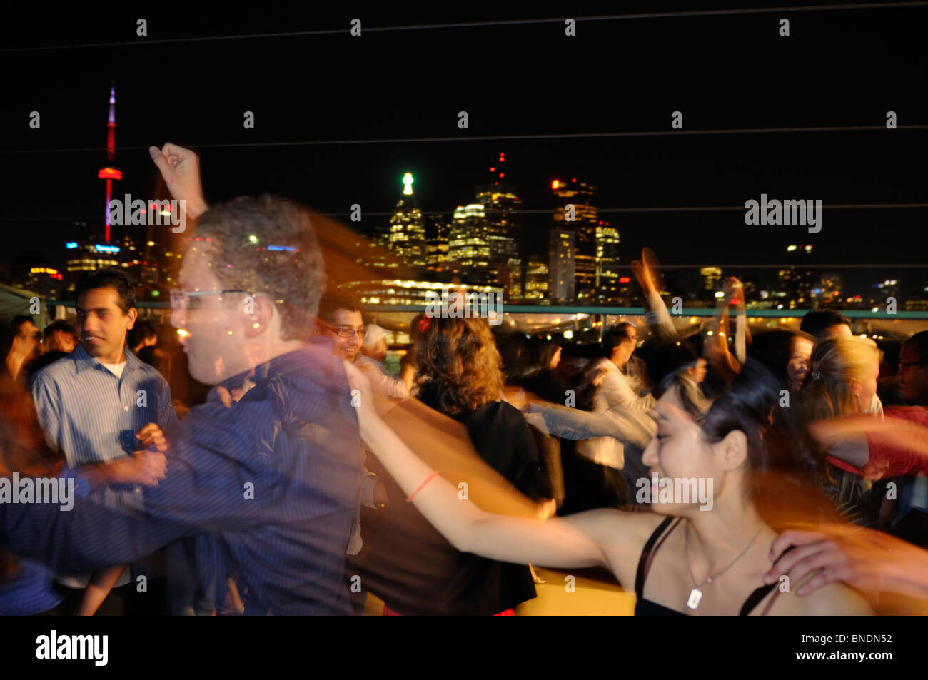 Conga line at the end of a Salsa dance boat cruise with Toronto city