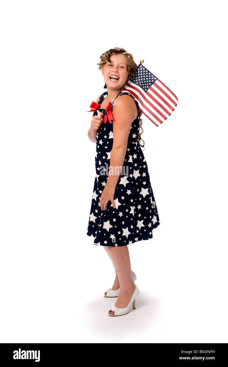 Portrait of young girl in studio laughing with American Flag Stock Photo