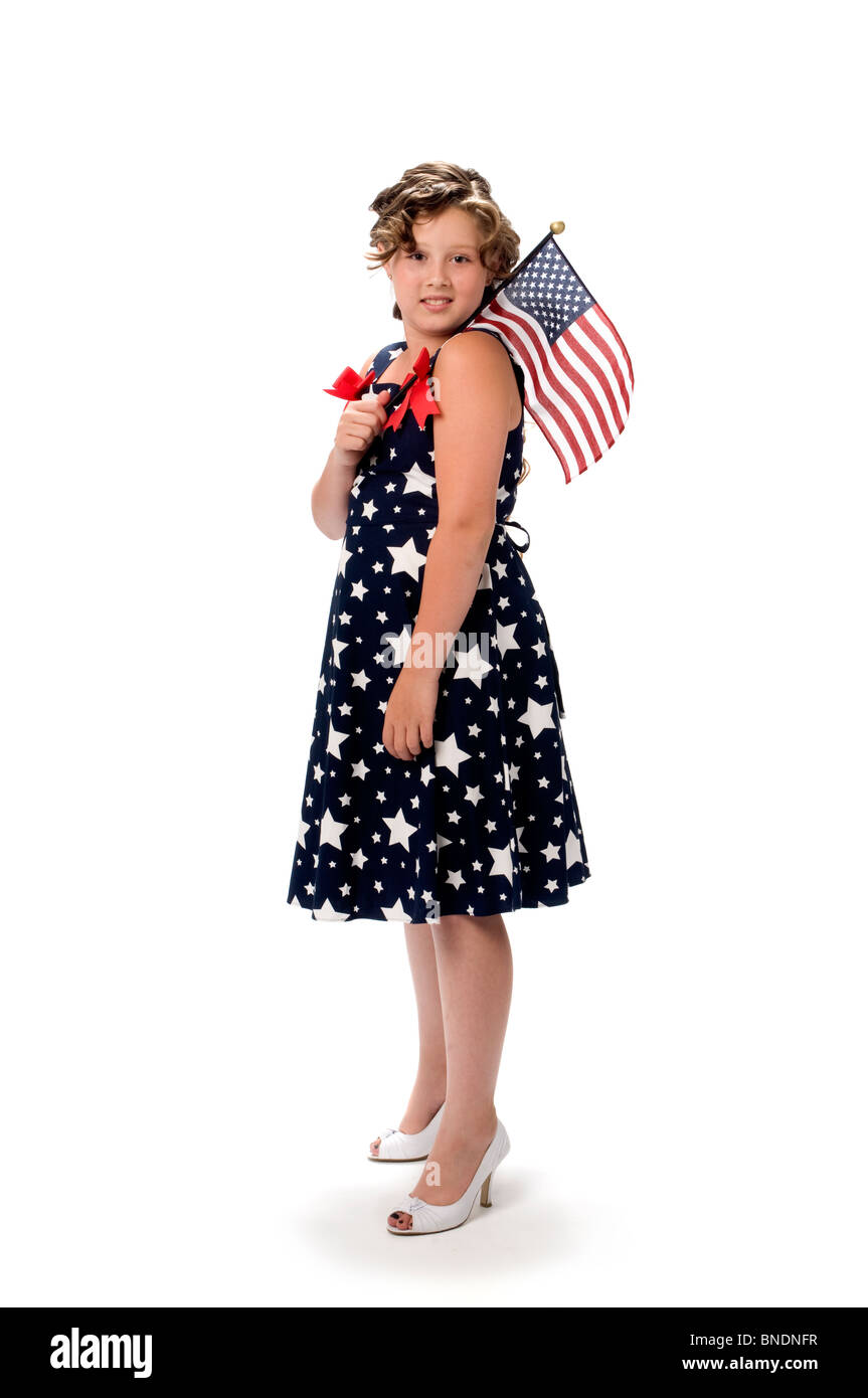 Portrait of young girl in studio holding flag Stock Photo