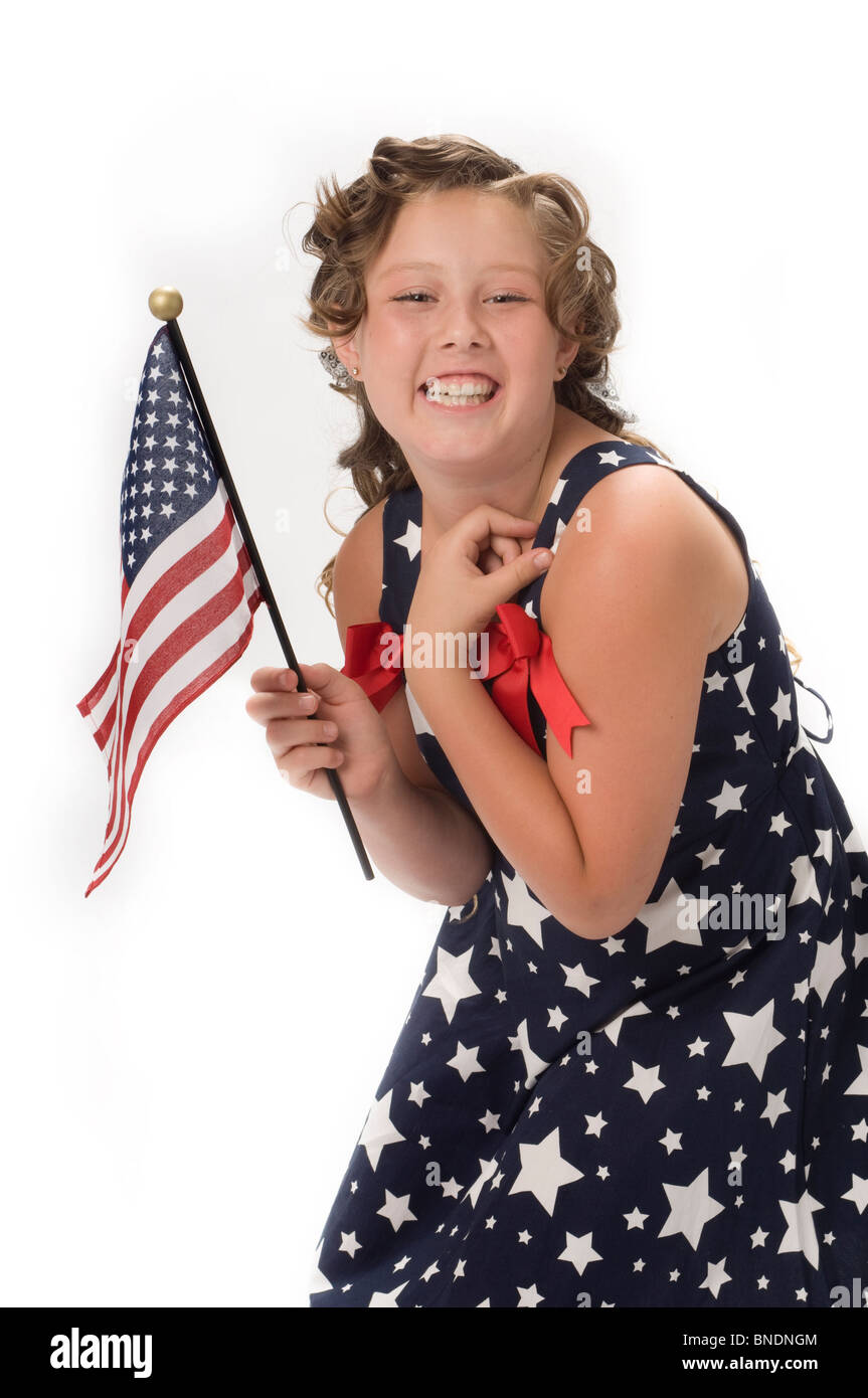 Portrait of young girl in studio with American Flag Stock Photo