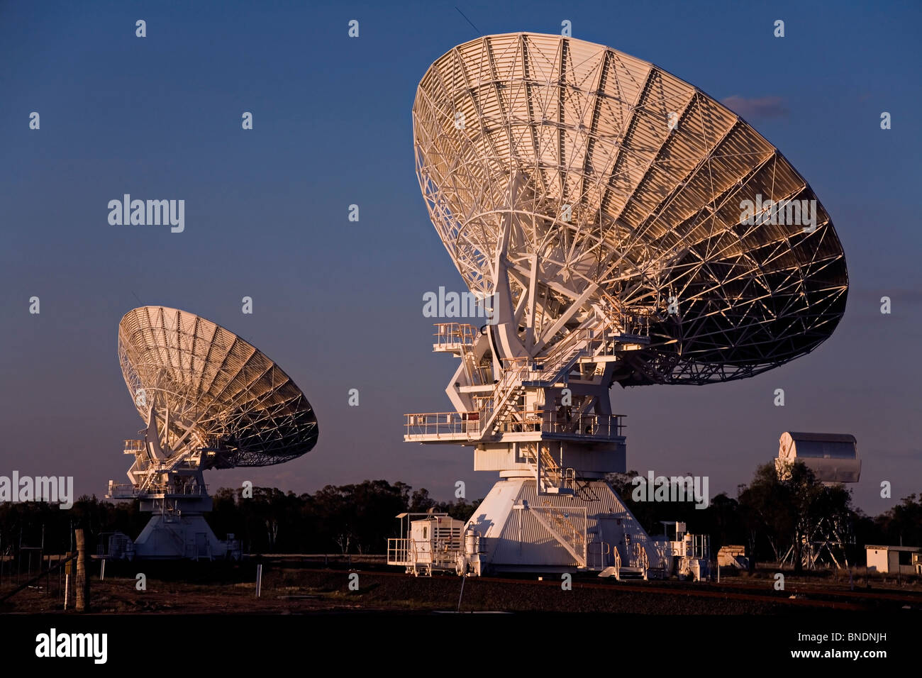 two compact array radio telescopes photographed at sunset, Narrabri, NSW, Australia Stock Photo