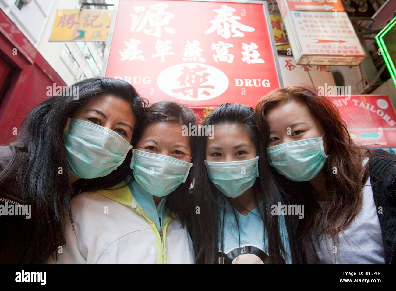 Girls wearing flu Masks, Hong Kong, China Stock Photo - Alamy