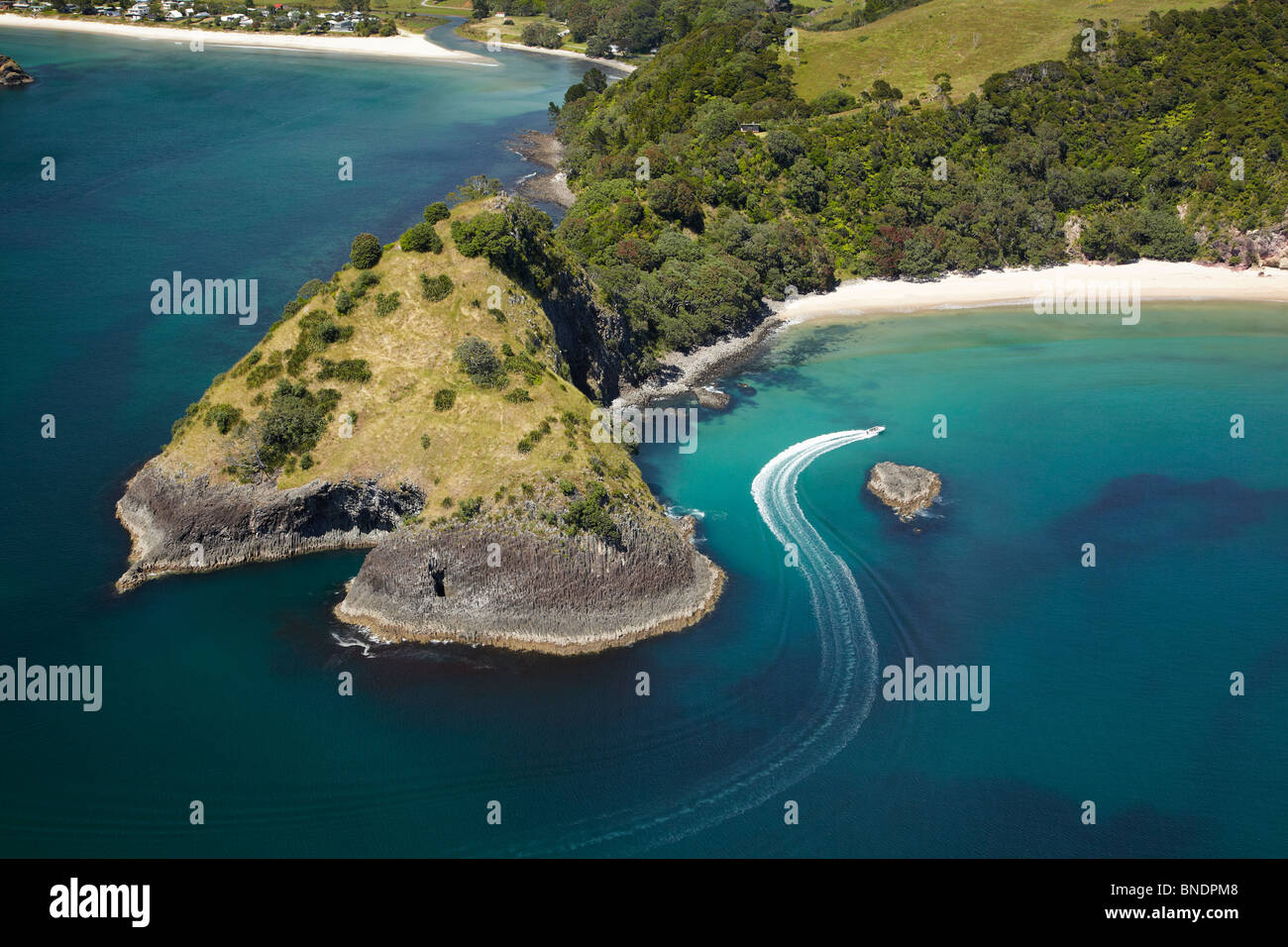 Speed Boat, New Chums Beach, Motuto Point, and Whangapoua, Coromandel Peninsula, North Island, New Zealand - aerial Stock Photo