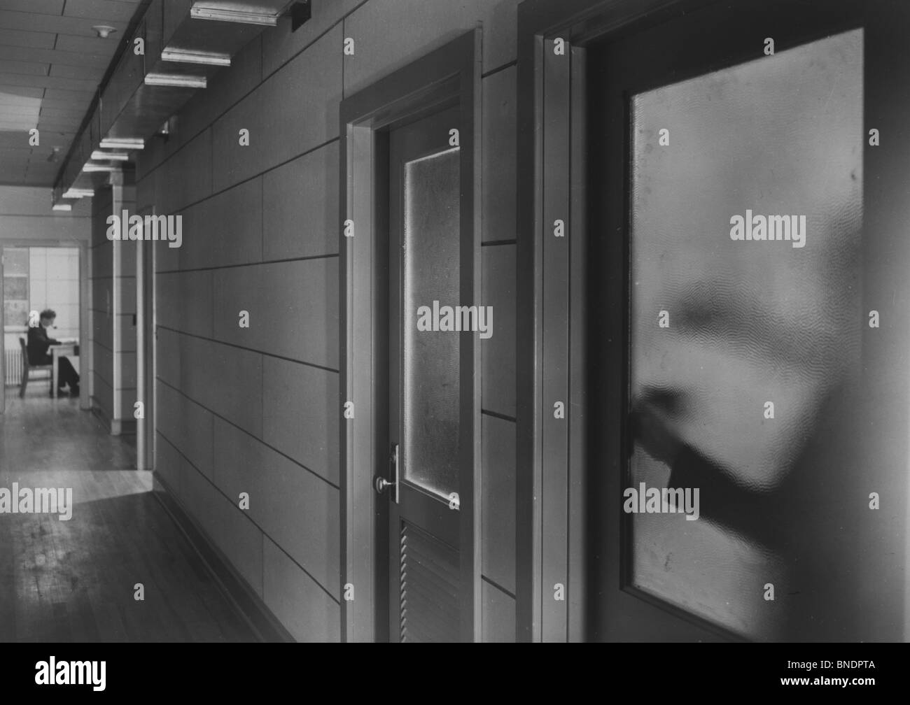Hiding at work office Black and White Stock Photos & Images - Alamy