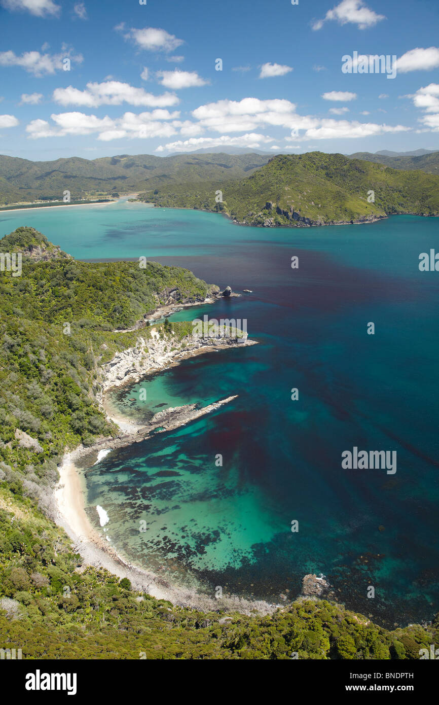 Rocky Coastline and Kennedy Bay, Coromandel Peninsula, North Island, New Zealand - aerial Stock Photo