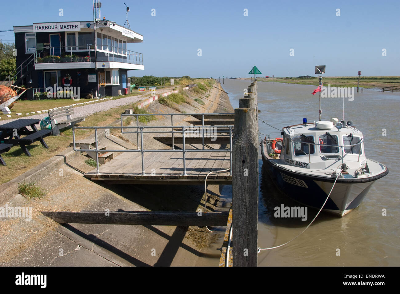 sea wall harbour harbor masters office modern boat Stock Photo Alamy