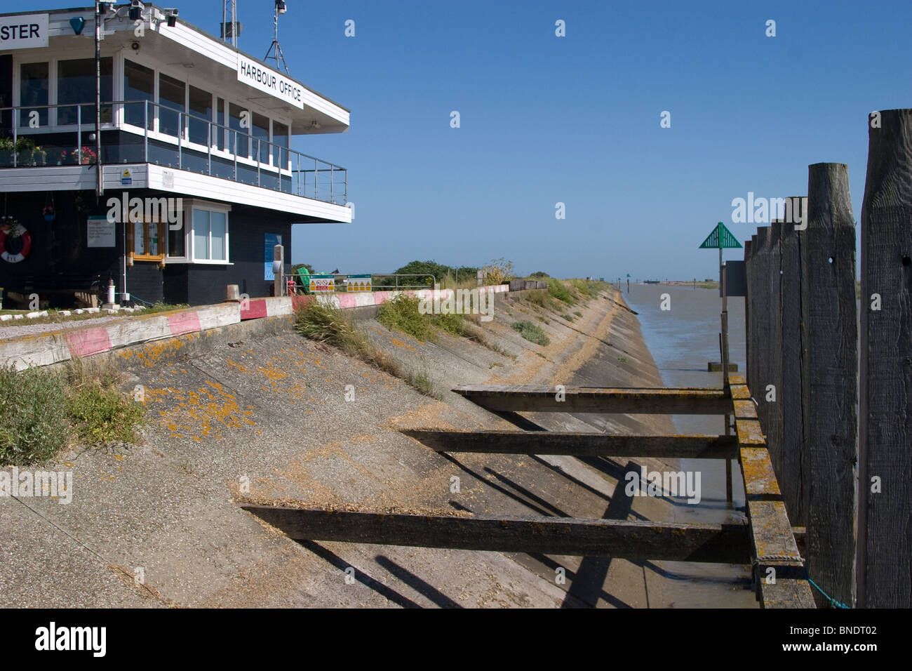 sea wall harbour harbor masters office modern sky Stock Photo Alamy