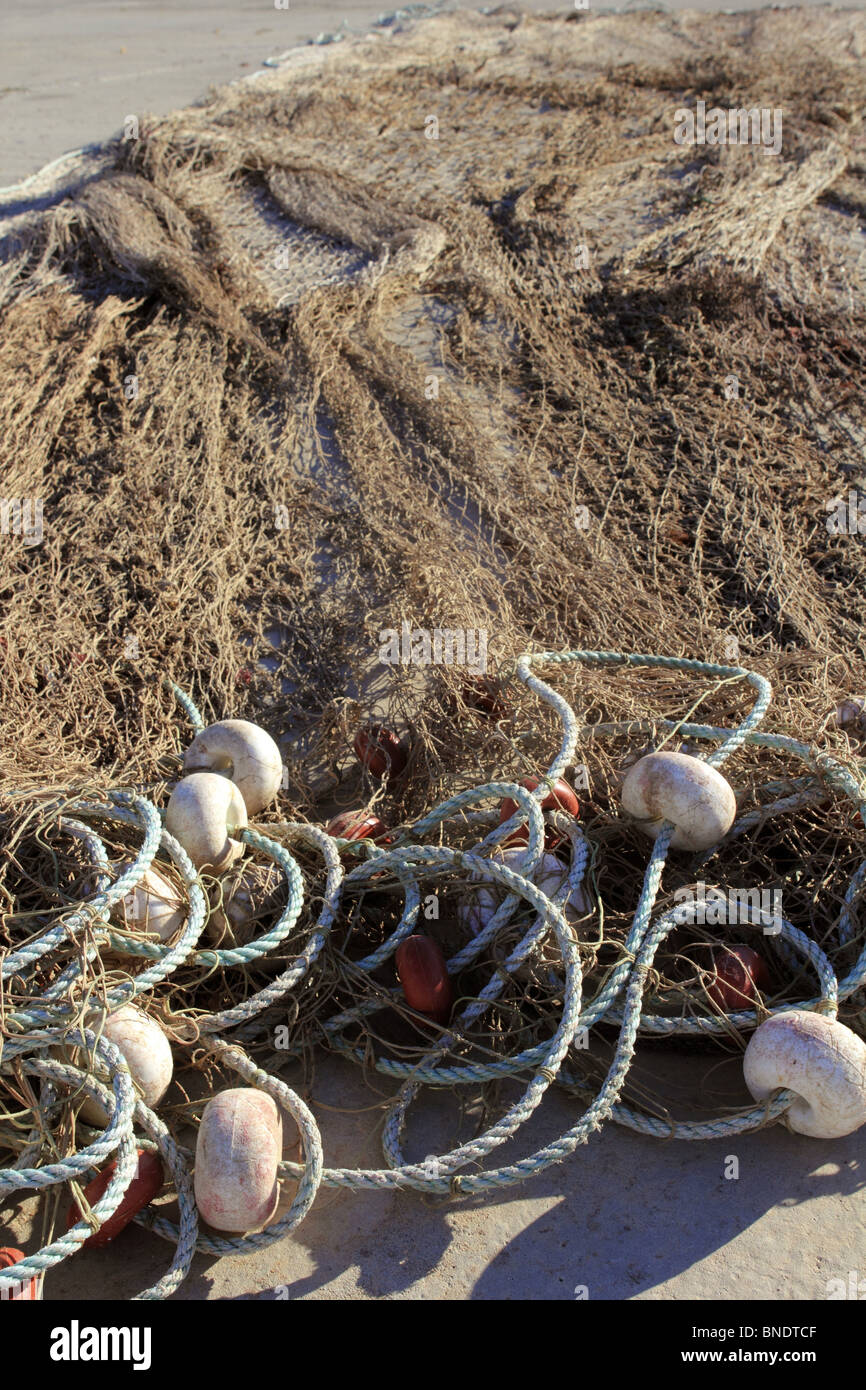 fishing net tackle over soil traditional fishery professional equipment Stock Photo