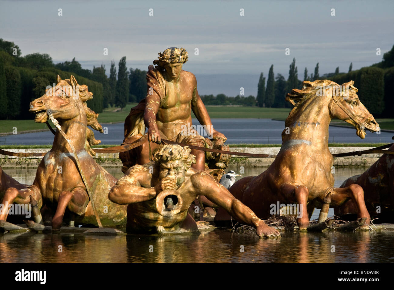 Fountain of Apollon's chariot pulled by its four horses in the garden