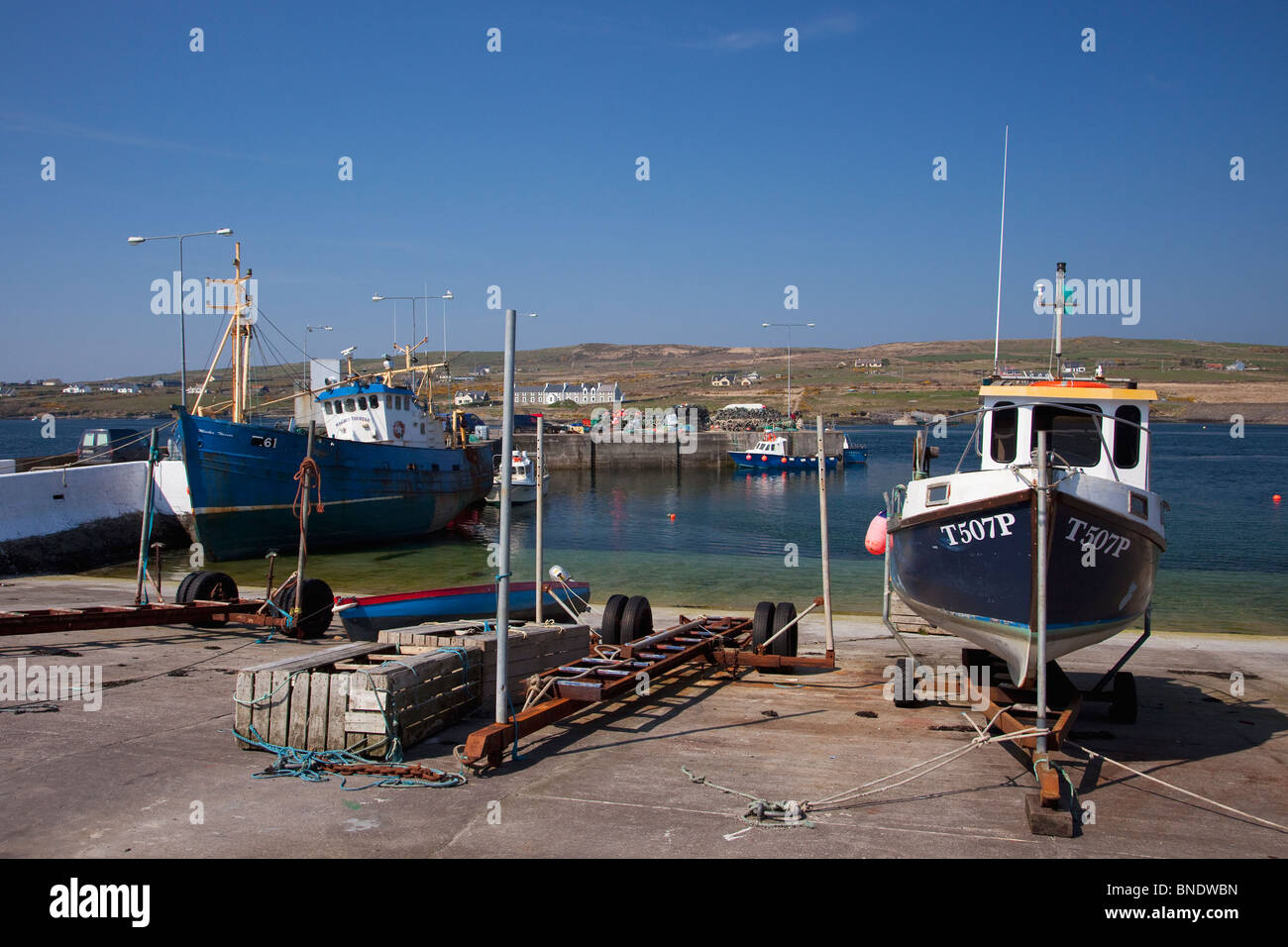 Fishing boats Portmagee harbour County Co. Kerry in spring sunshine Republic of Ireland Eire Europe Stock Photo