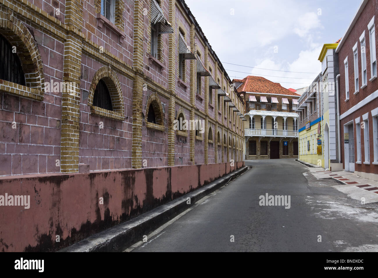 Old colonial stone buildings on a street in St George's, Grenada, West Indies, Caribbean Sea Stock Photo