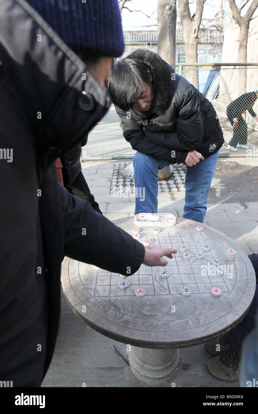 China, Beijing, xiangqi (Chinese Chess) players in a park Stock Photo