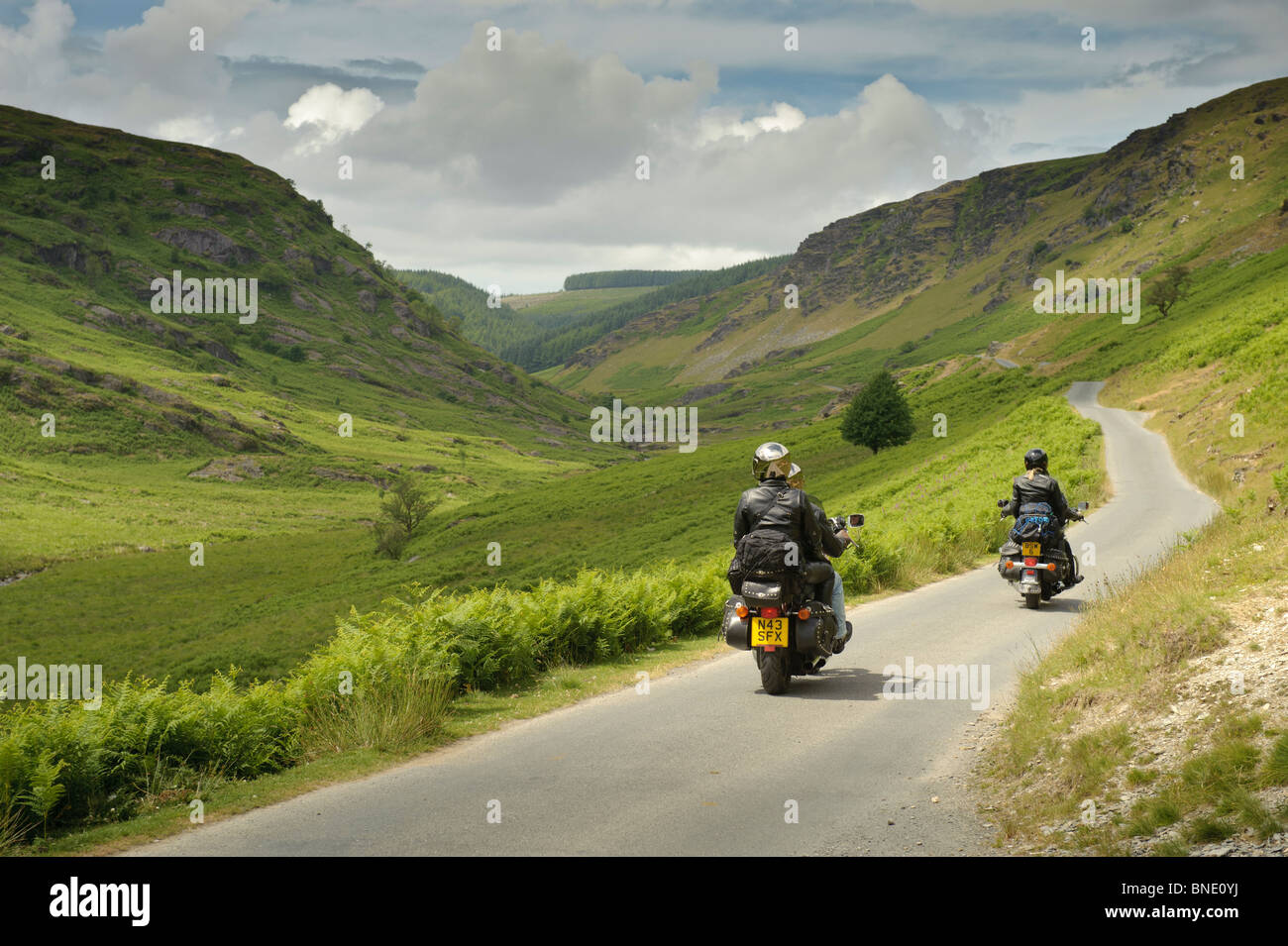 People bikers on motorbikes motorcycling motorbiking through Abergwesyn pass, Powys, Mid wales UK Stock Photo
