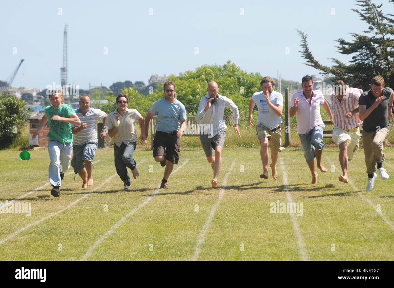 The Dads school race in at Flushing School Cornwall. Stock Photo