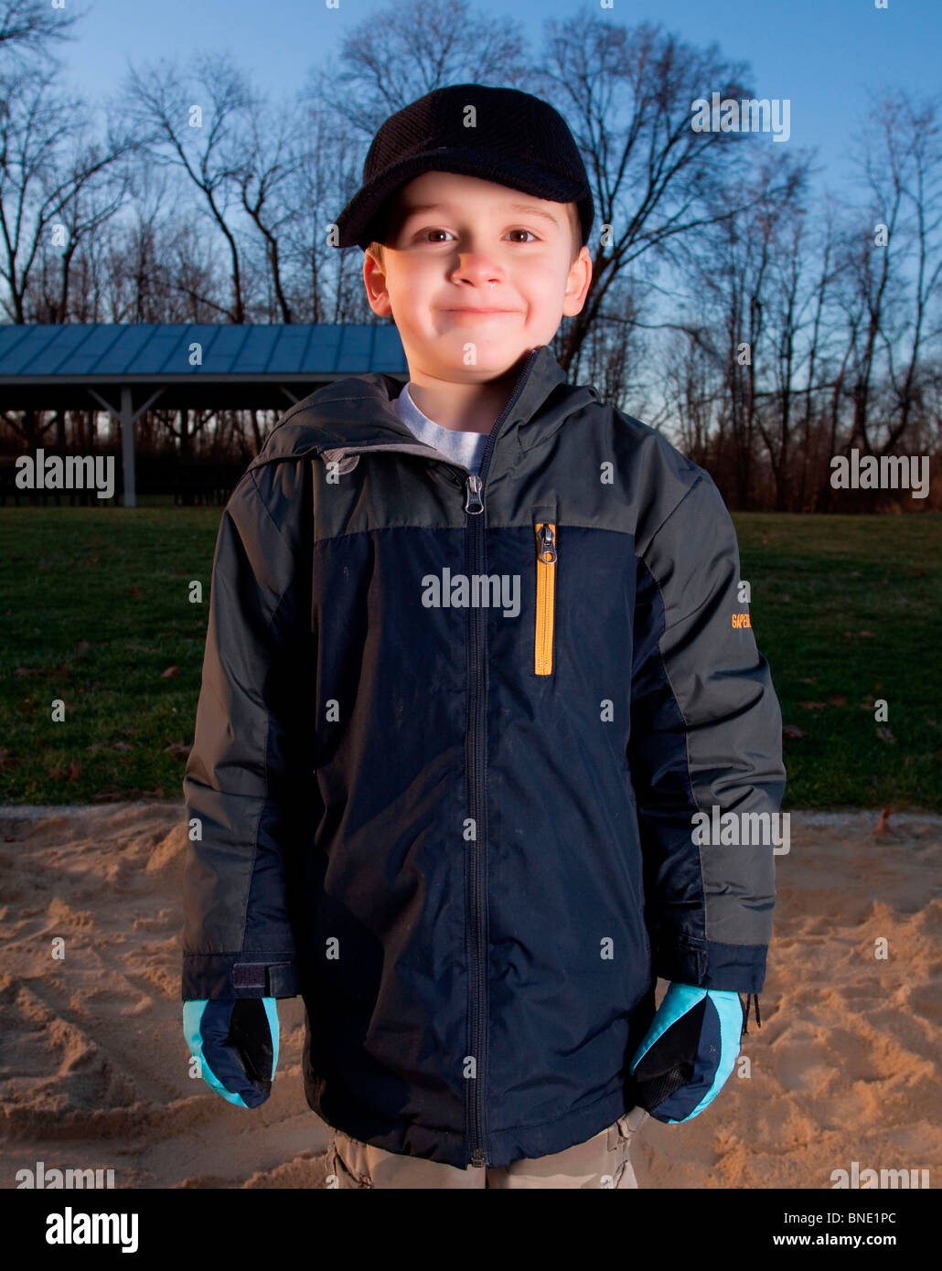 Boy smiling in a playground Stock Photo - Alamy