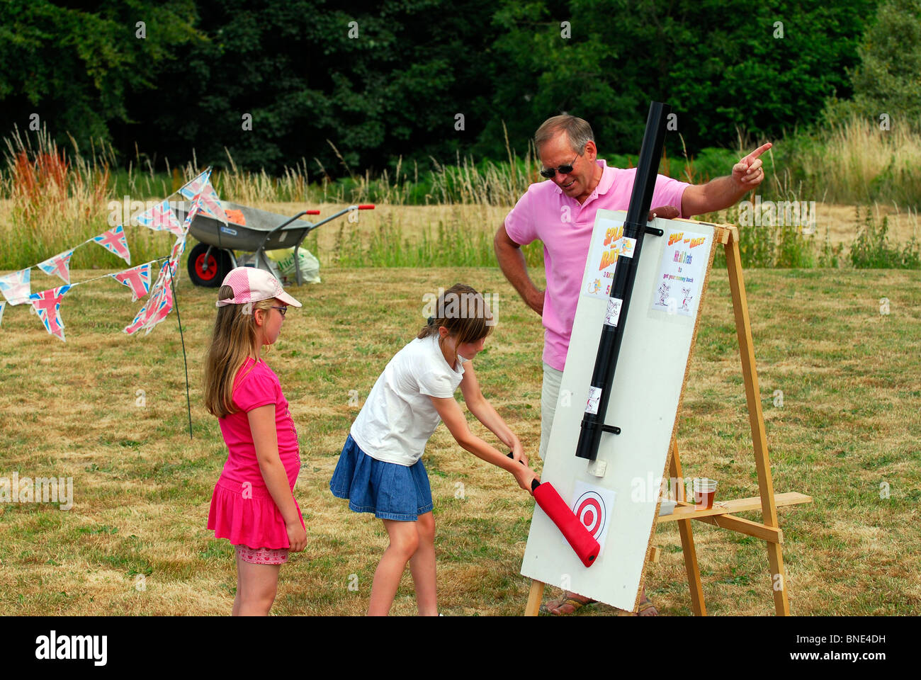 Youngsters playing 'Splat the Rat' at Worldham Village fete, near Alton, Hampshire, UK. Stock Photo