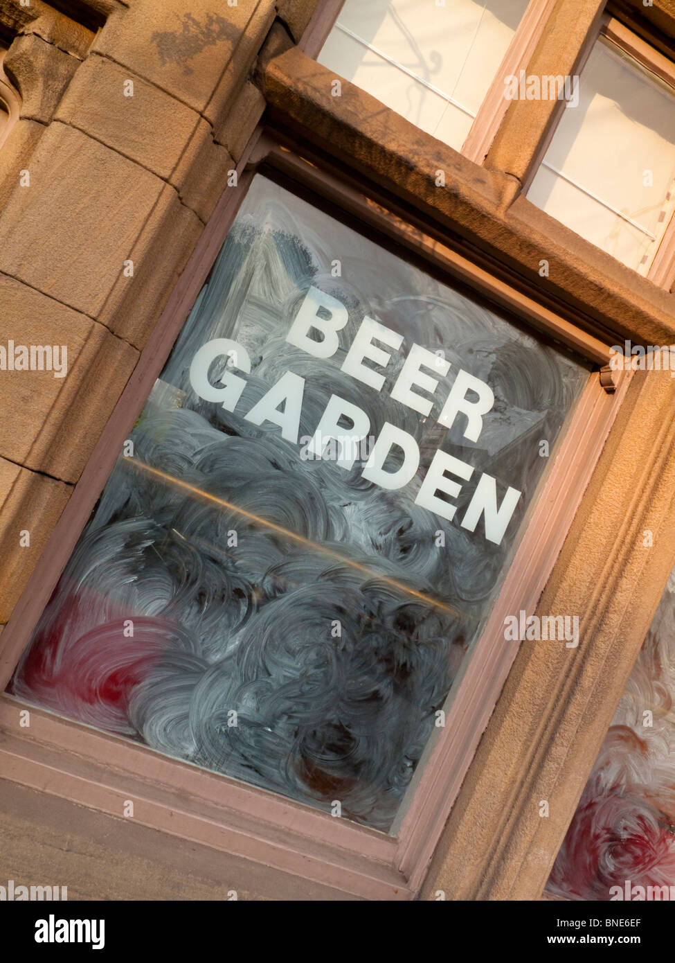 Windows of closed and empty pub premises in Matlock Derbyshire England UK Stock Photo