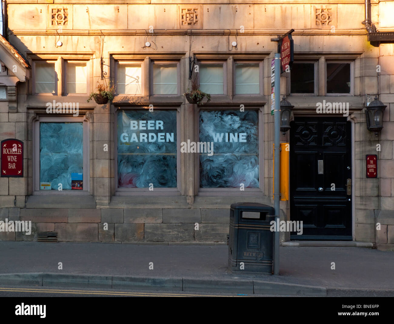 Windows of closed and empty pub premises in Matlock Derbyshire England UK Stock Photo