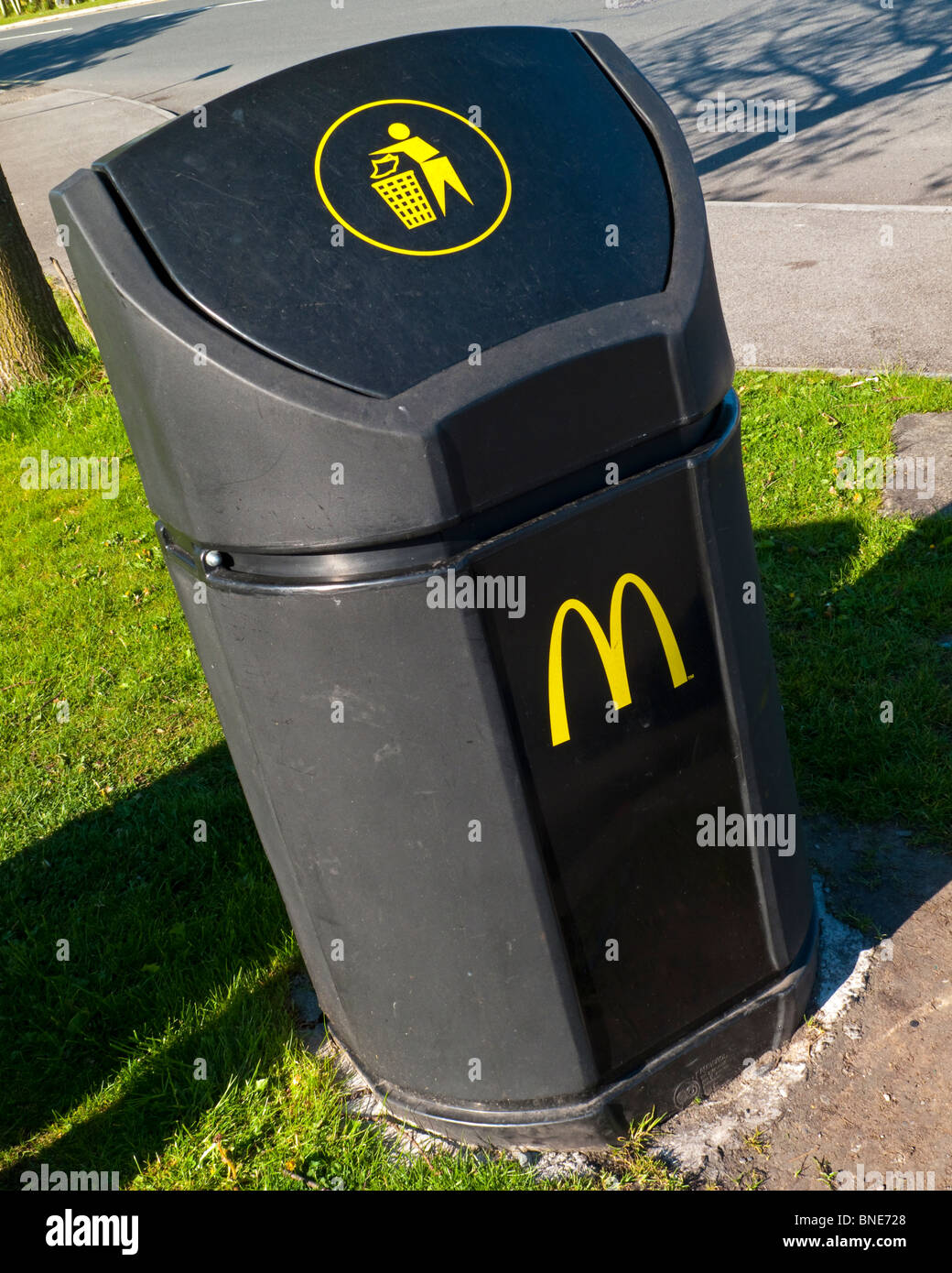 Litter bin outside a McDonald's fast food restaurant with M logo on