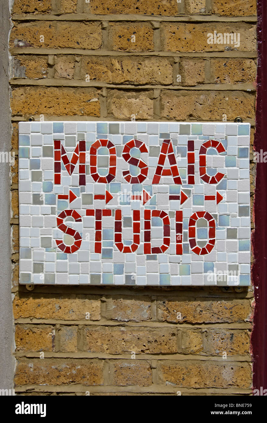 the words mosaic studio spelt out in mosaic tiles at a gallery in