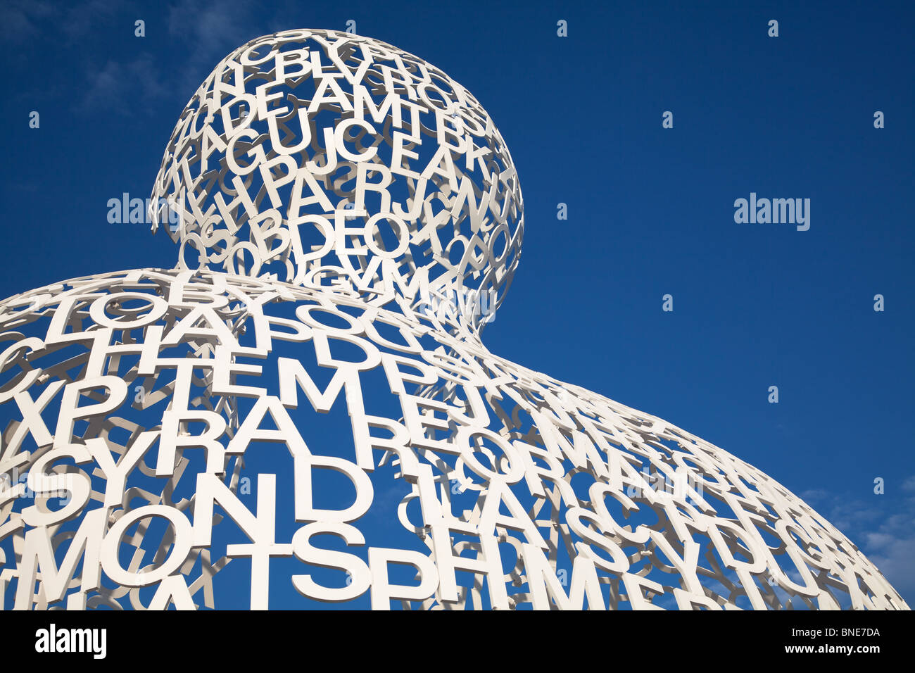 La Grande Nomade d'Antibes by Jaume Plensa, Antibes, France. the image shows the artwork against a deep blue sky Stock Photo