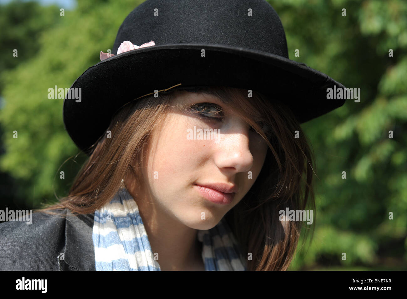 Teenage girl wearing old battered black bowler hat hi-res stock photography  and images - Alamy
