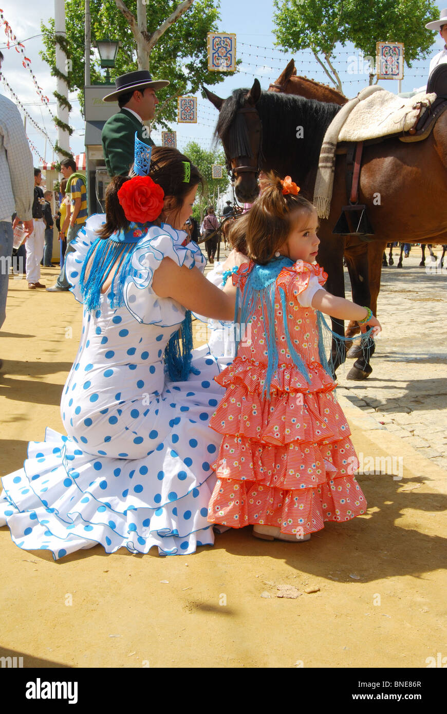 Mother and daughter in Flamenco dresses, Feria ground, April spring fair,  Seville, Seville Province, Andalucia, Spain, Europe Stock Photo - Alamy