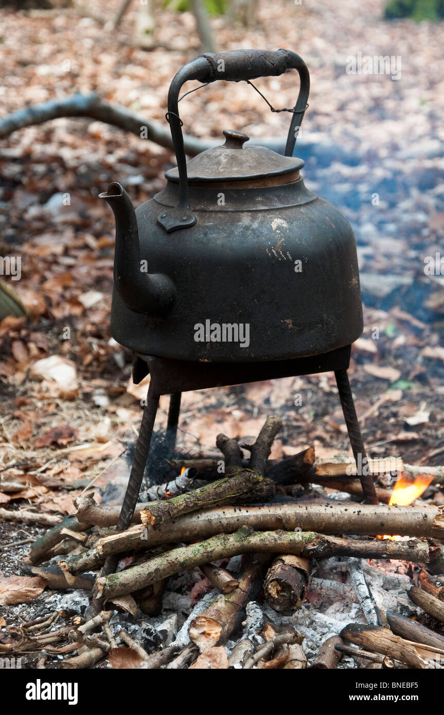 https://c8.alamy.com/comp/BNEBF5/old-used-blackened-kettle-on-a-small-campfire-BNEBF5.jpg