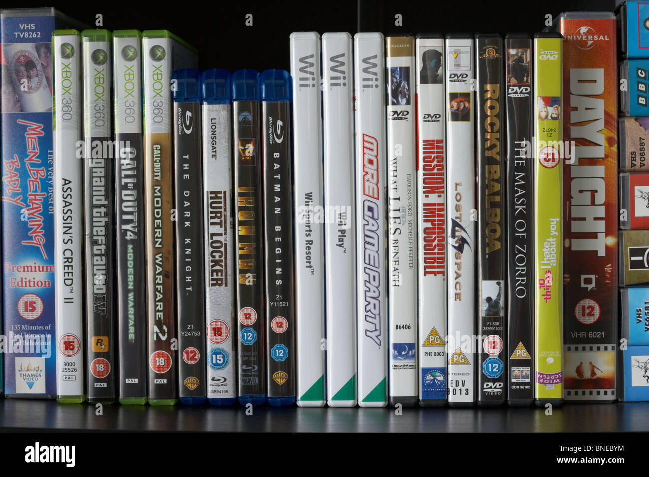 row of dvd vhs blu-ray video cases and wii and xbox360 video games on a  shelf in the uk Stock Photo - Alamy