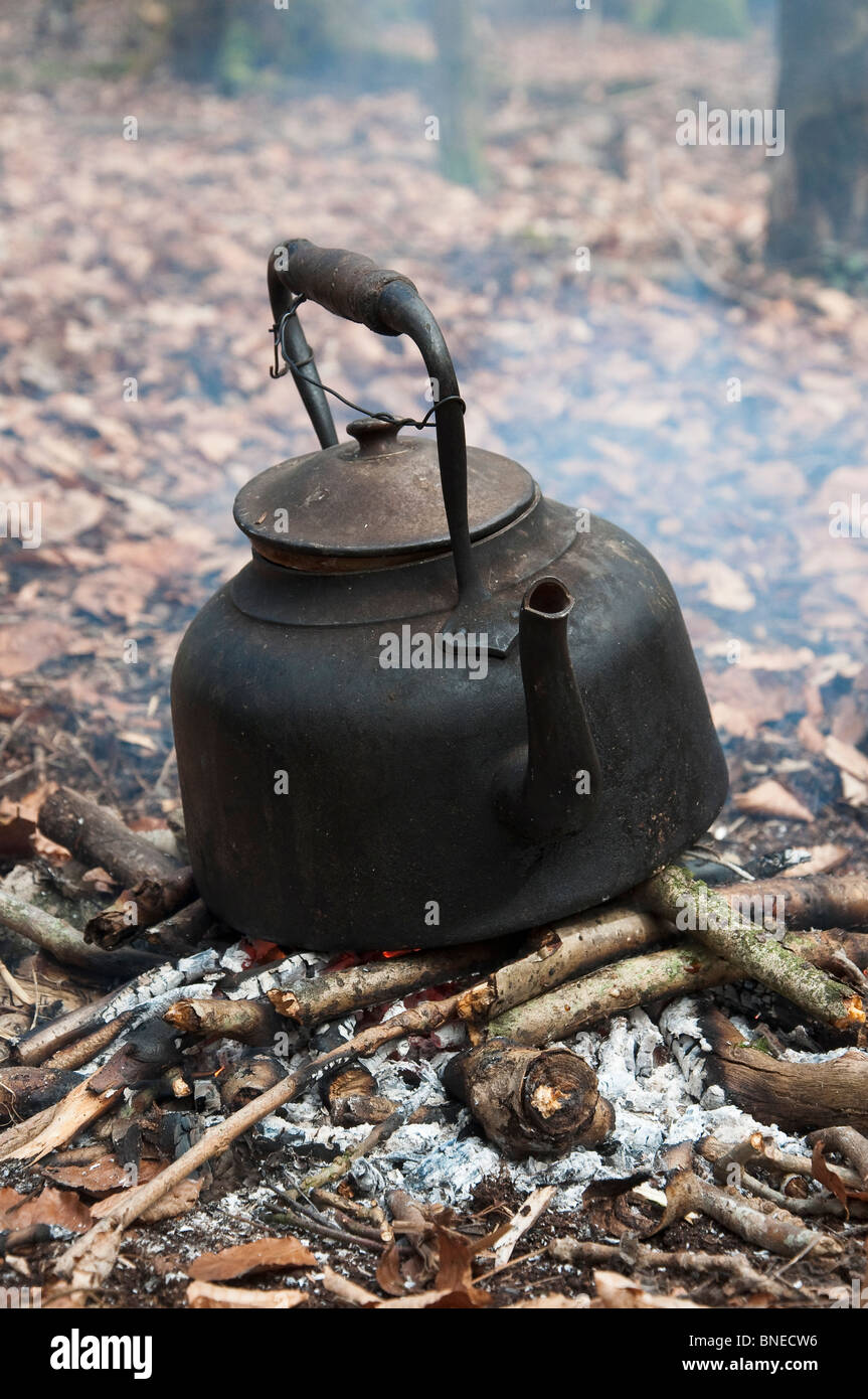 Ancient tea kettle on campfire Stock Photo - Alamy