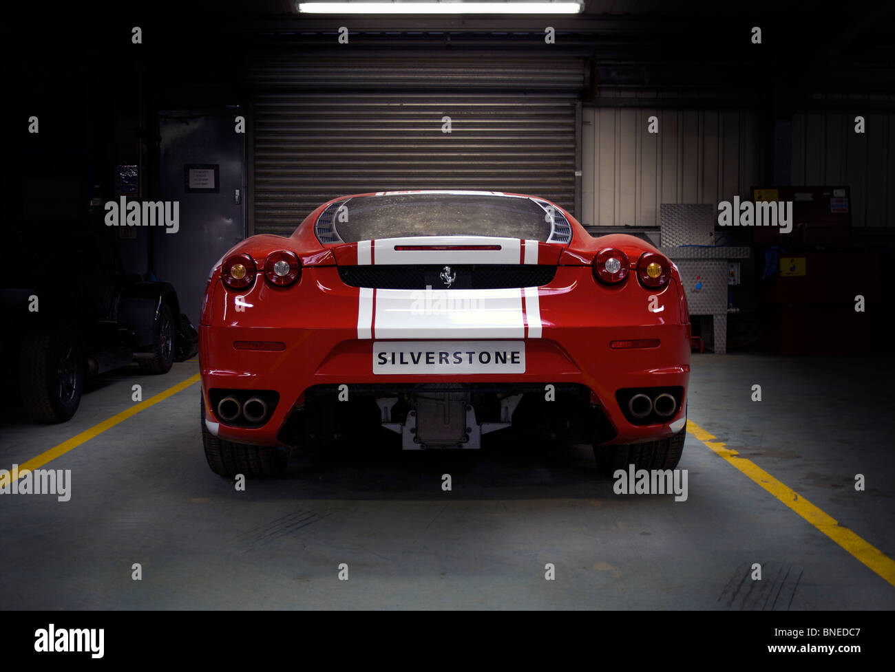 A Ferrari Sports Car In A Garage At Silverstone Circuit In England