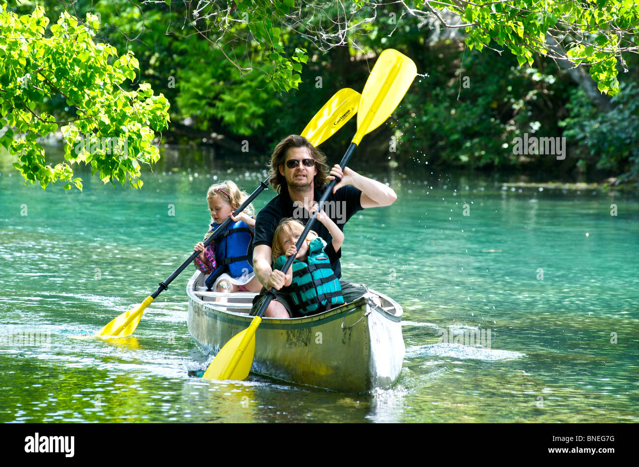 Father and children rowing a boat in Texas, USA Stock Photo Alamy