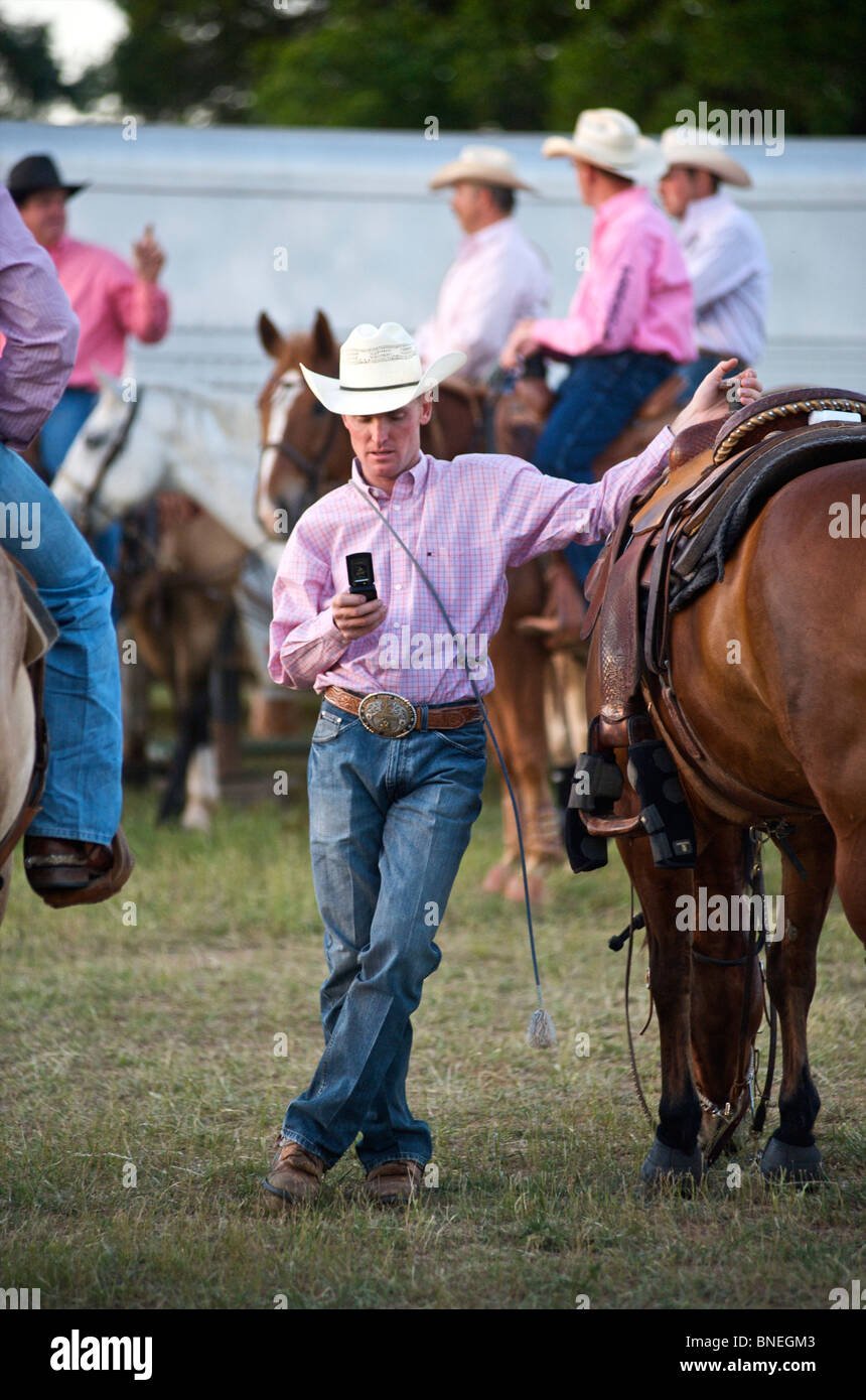 Cowboy members of  PRCA standing backstage at rodeo event in Bridgeport  Texas, USA Stock Photo